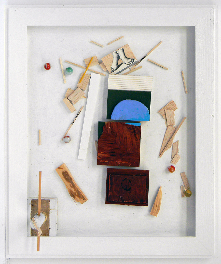 In the artist's frame ( 20 inches x 17 inches ) are various things glued to a board.