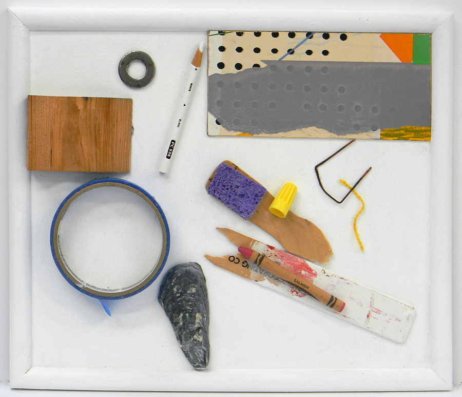 Things glued to a board in a frame that is 11 inches x 17 inches.