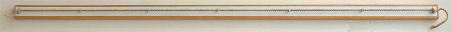 Rope extended through eye screws. 58" wide