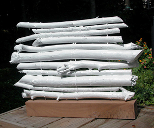 Sticks on three wires & painted white