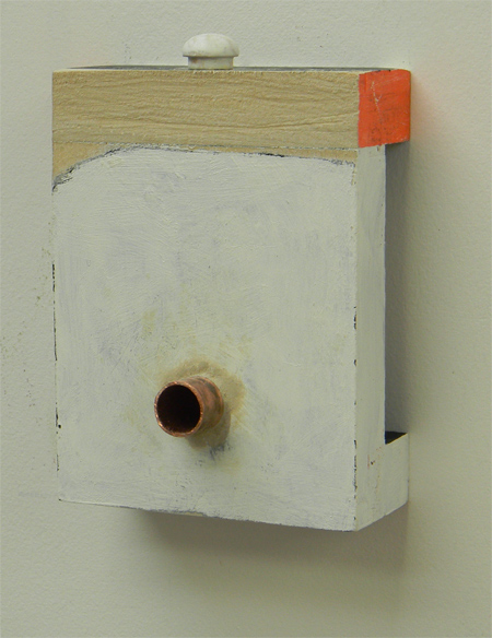 Painted wood with copper tube and white wood button at the top.