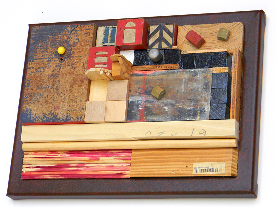 New Construction. Mostly wood items glued to linen canvas, 9 inches x 12 inches. About 2.5 inches high.