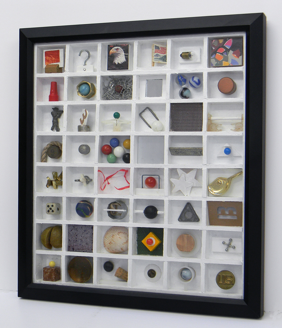 New Construction. Frame with glass, 16 inches x 14 inches, with painted balsa wood grid that is 1.75 inches deep, with various objects inside the structure.