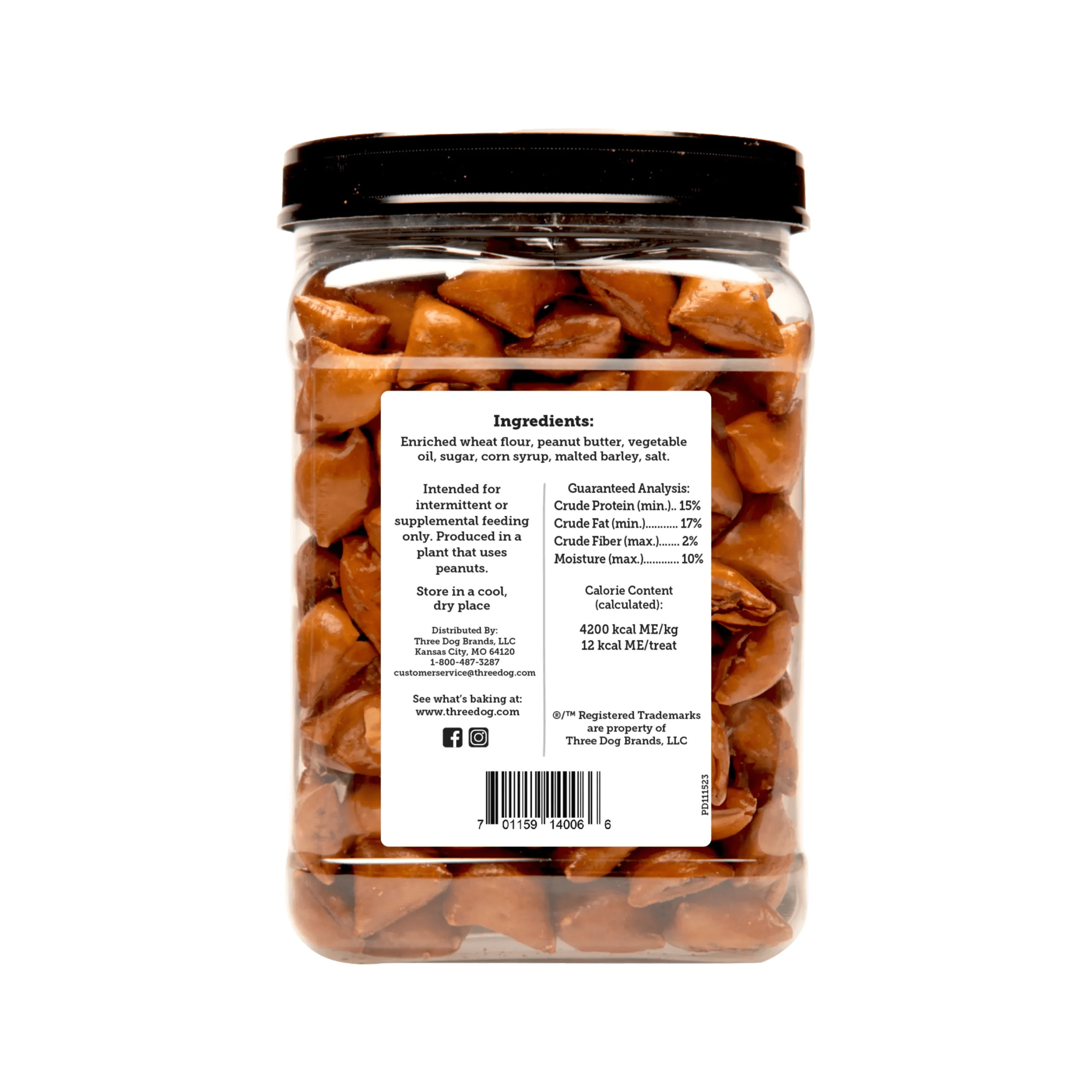 An image depicting the back of a container of Three Dog Bakery Pet-Zel Bites dog treats with real peanut butter filling. The back of the container displays information about the dog treats, a list of ingredients, the calorie content (which is 4200 kcal ME per kg or 12 kcal ME per treat), as well as a Guaranteed Analysis chart, which reads "Crude Protein (minimum) 15%, Crude Fat (minimum) 17%, Crude Fiber (maximum) 2%, and Moisture (maximum) 10%".