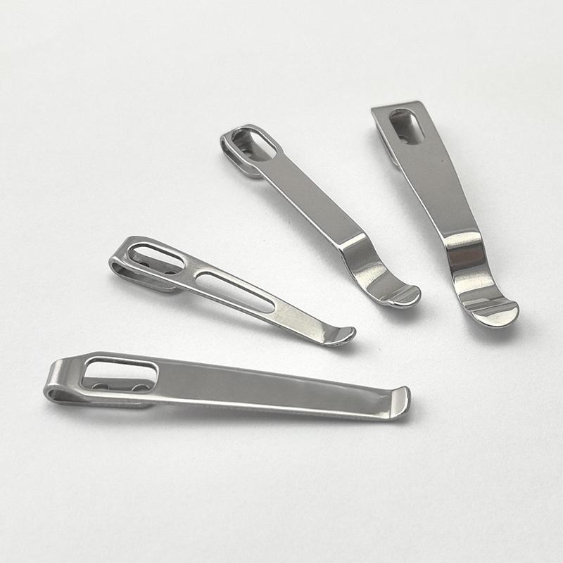 A stainless steel pocket back clip with mounting screws next to a folding knife handle for DIY knife making.