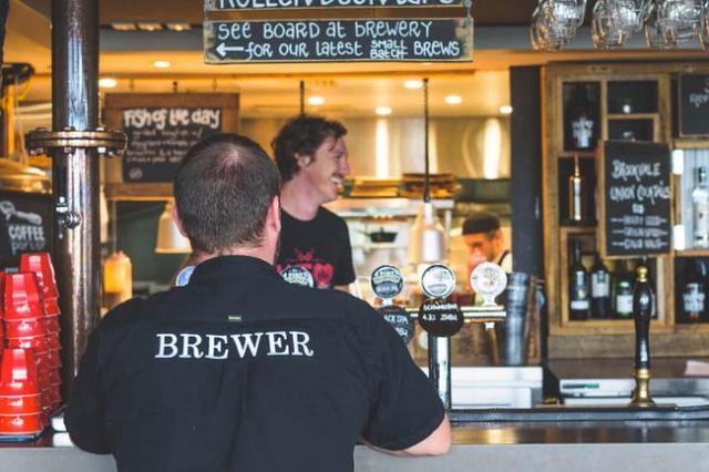 A person sitting at a bar

Description automatically generated with low confidence