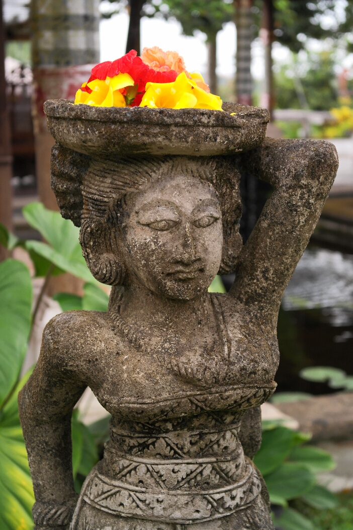 Statue with offerings