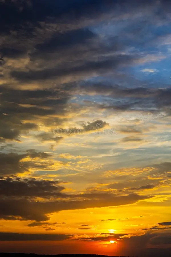 Sunset sky with multicolor clouds. dramatic twilight sky background