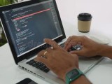Programmer Man Writing Program Code Sitting At Workplace In Office