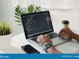 Programmer Man Writing Program Code Sitting At Workplace In Office