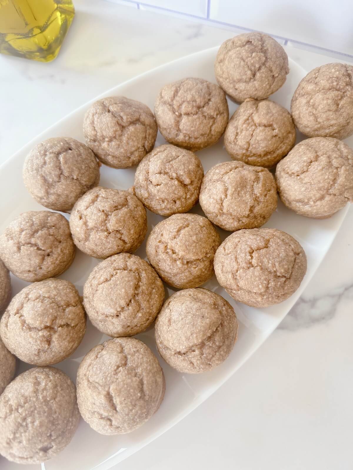 Mini Blender Peanut Butter Banana Oat Muffins baked and ready to eat from a serving tray.
