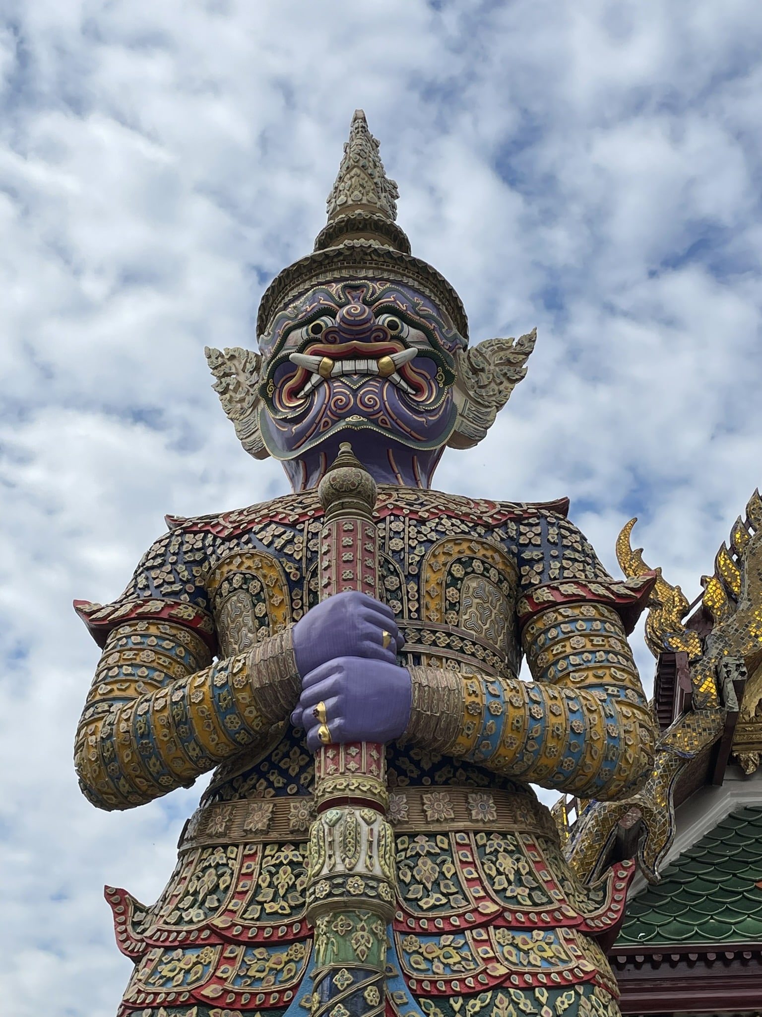 close up of blinged out statue of some kind of guard holding a sword