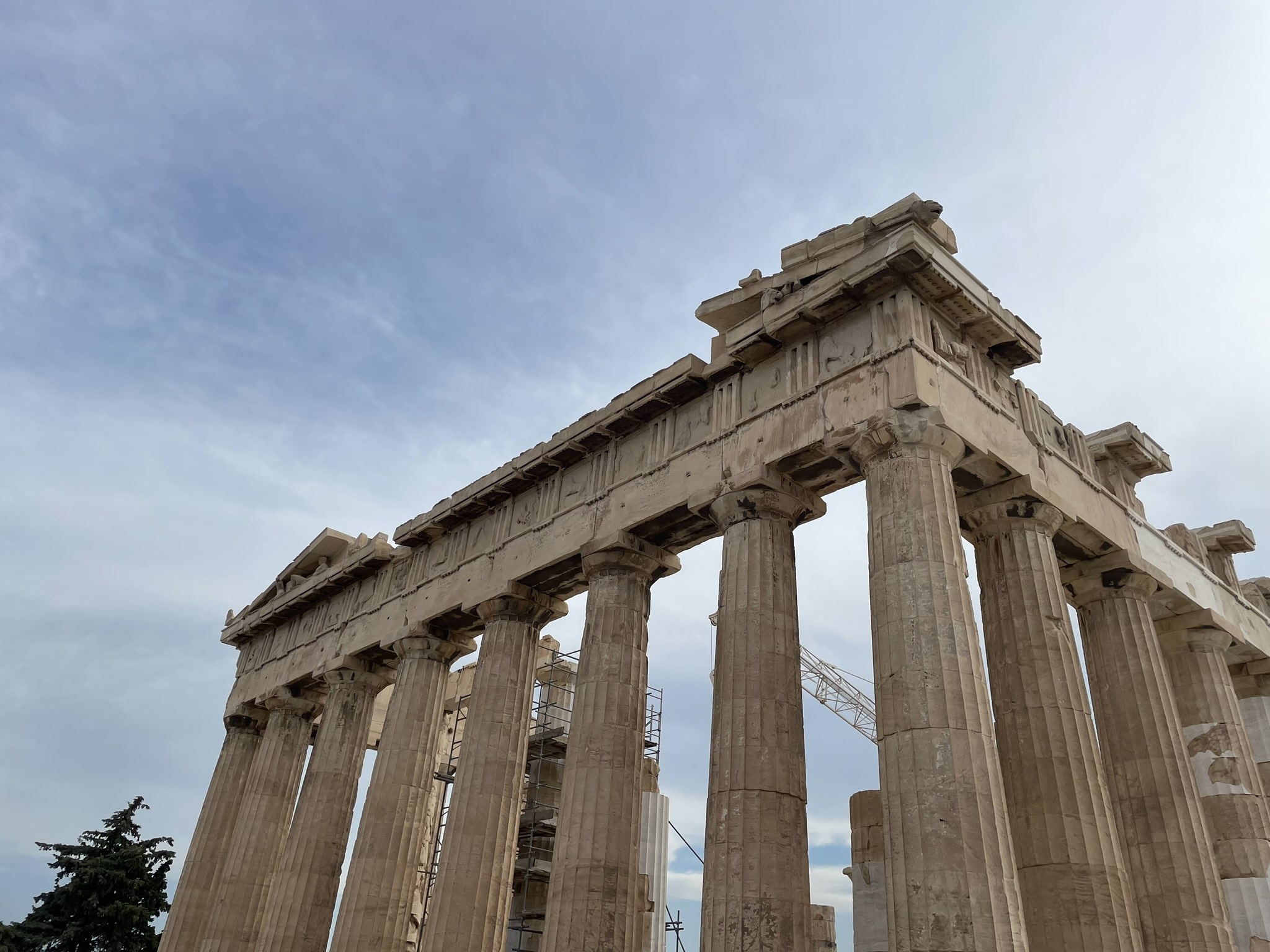 Parthenon columns with crane in the background