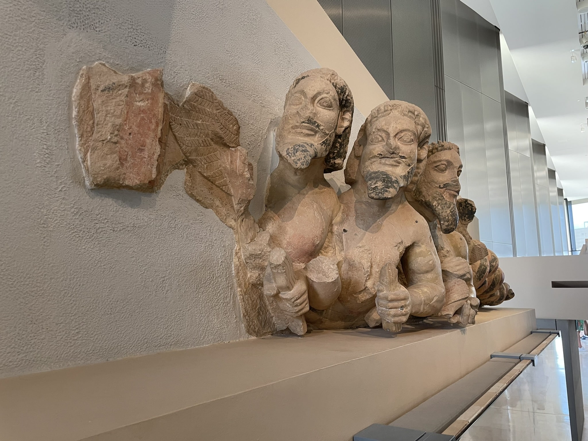 male heads and upper torsos in a line