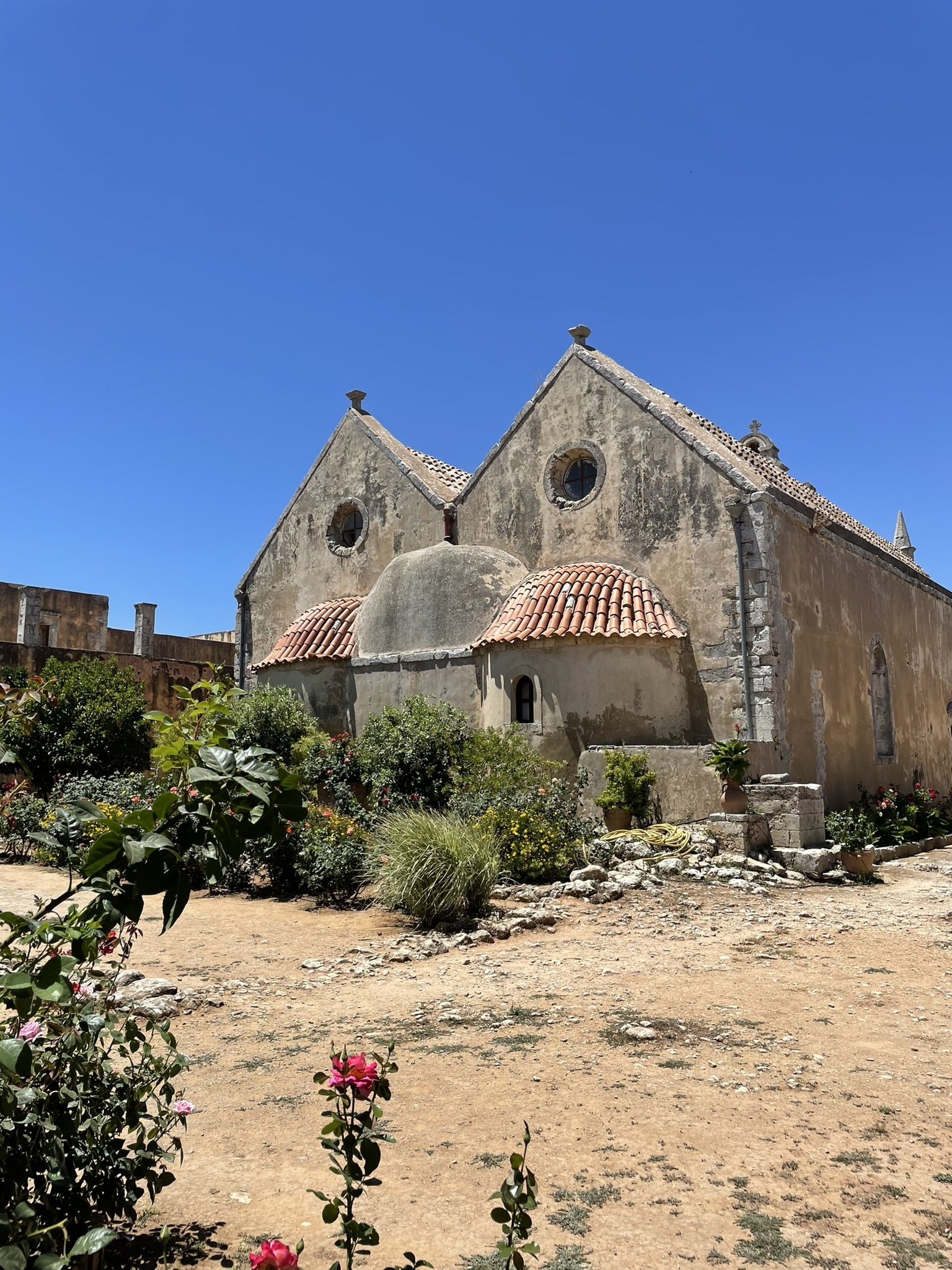 Stone building with two twin peaked rooftops