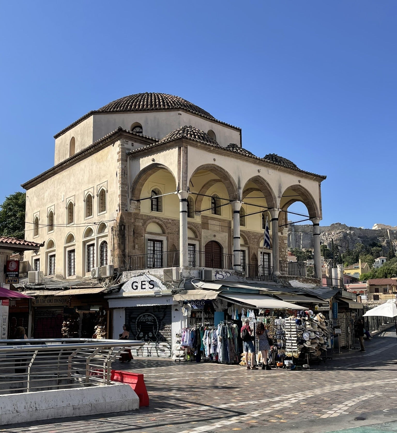 large domed building fronted with a multi-arched portico