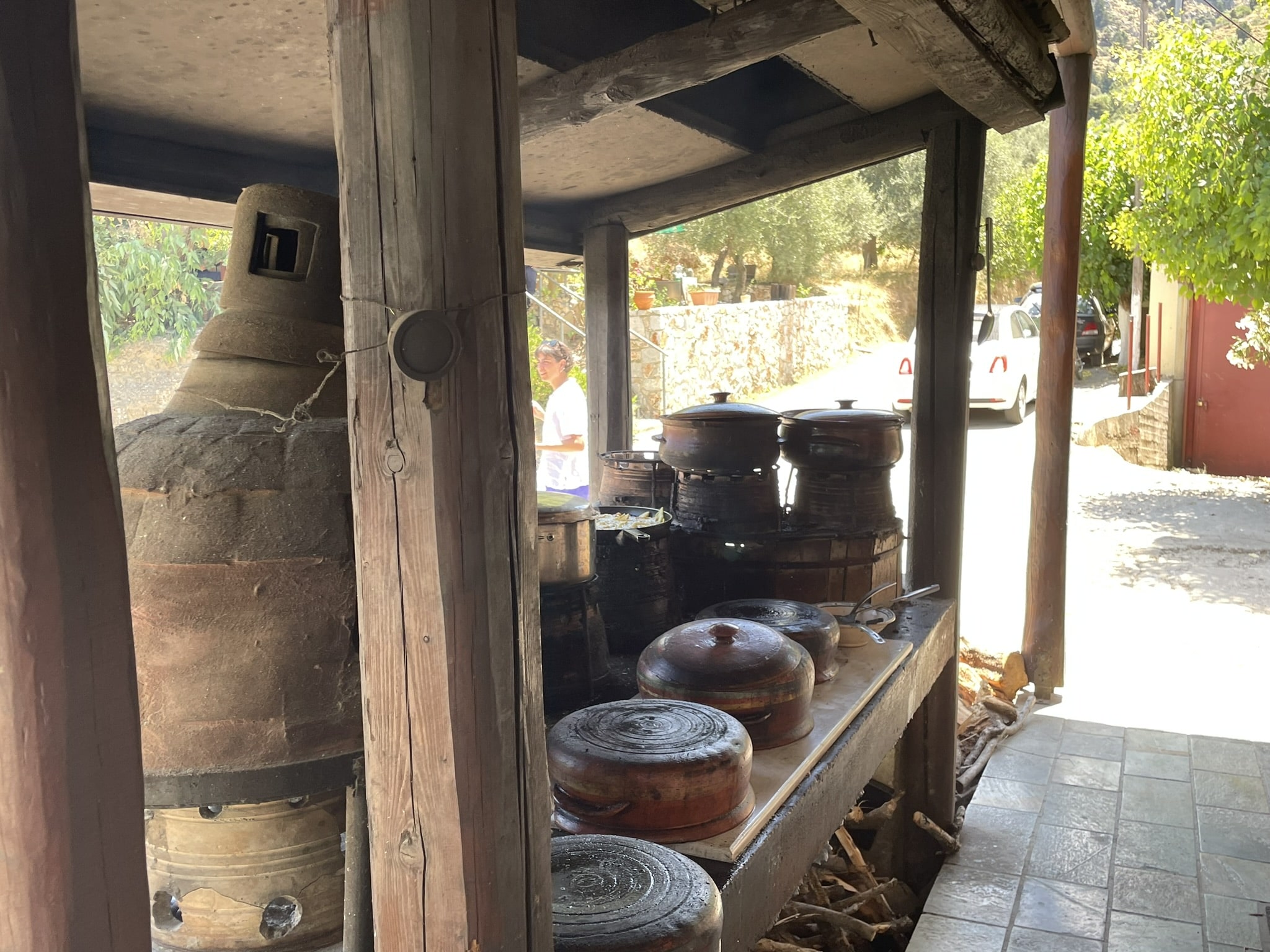 outdoor cooking area featuring several pots