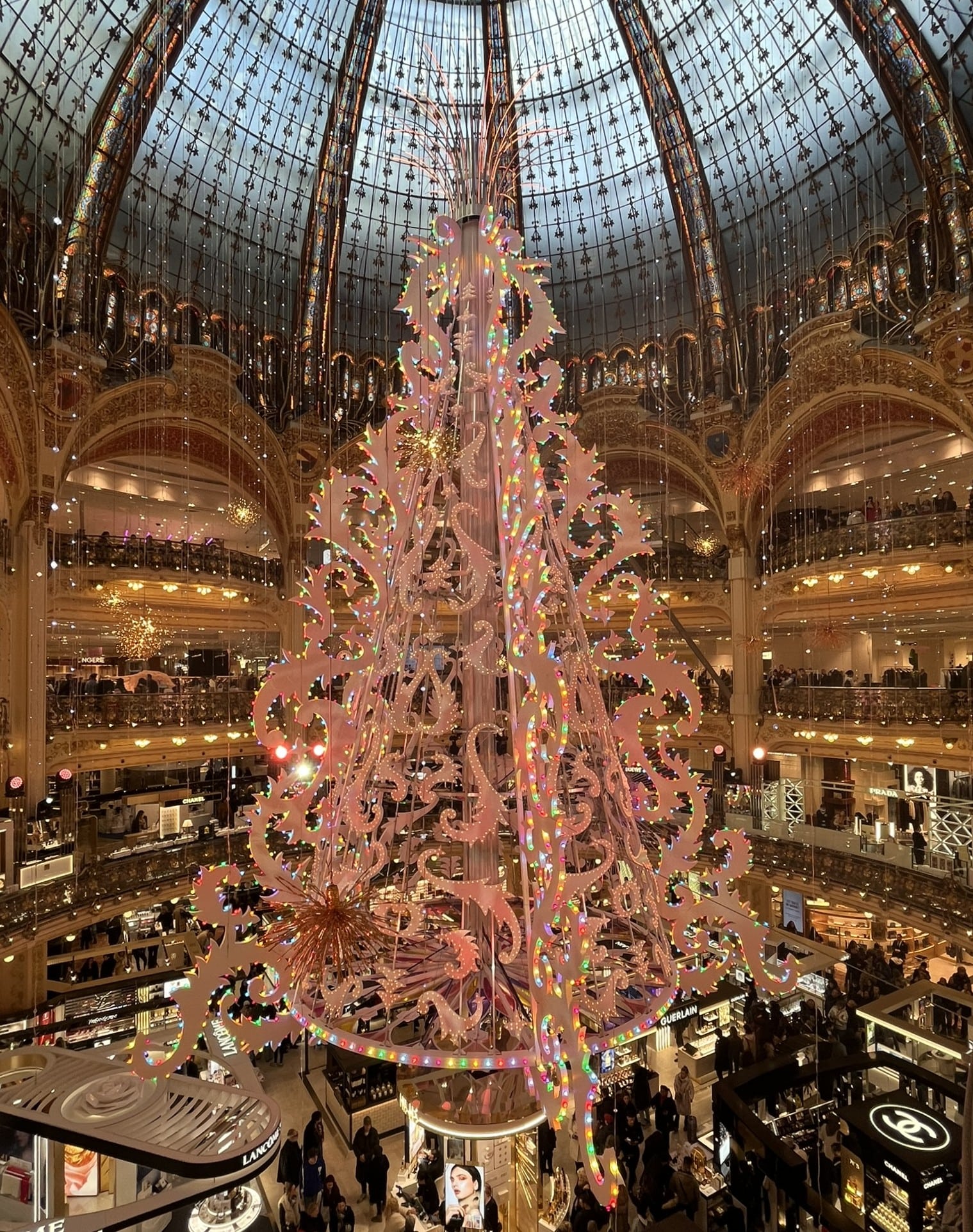 multi-story pink Christmas tree under a glass dome