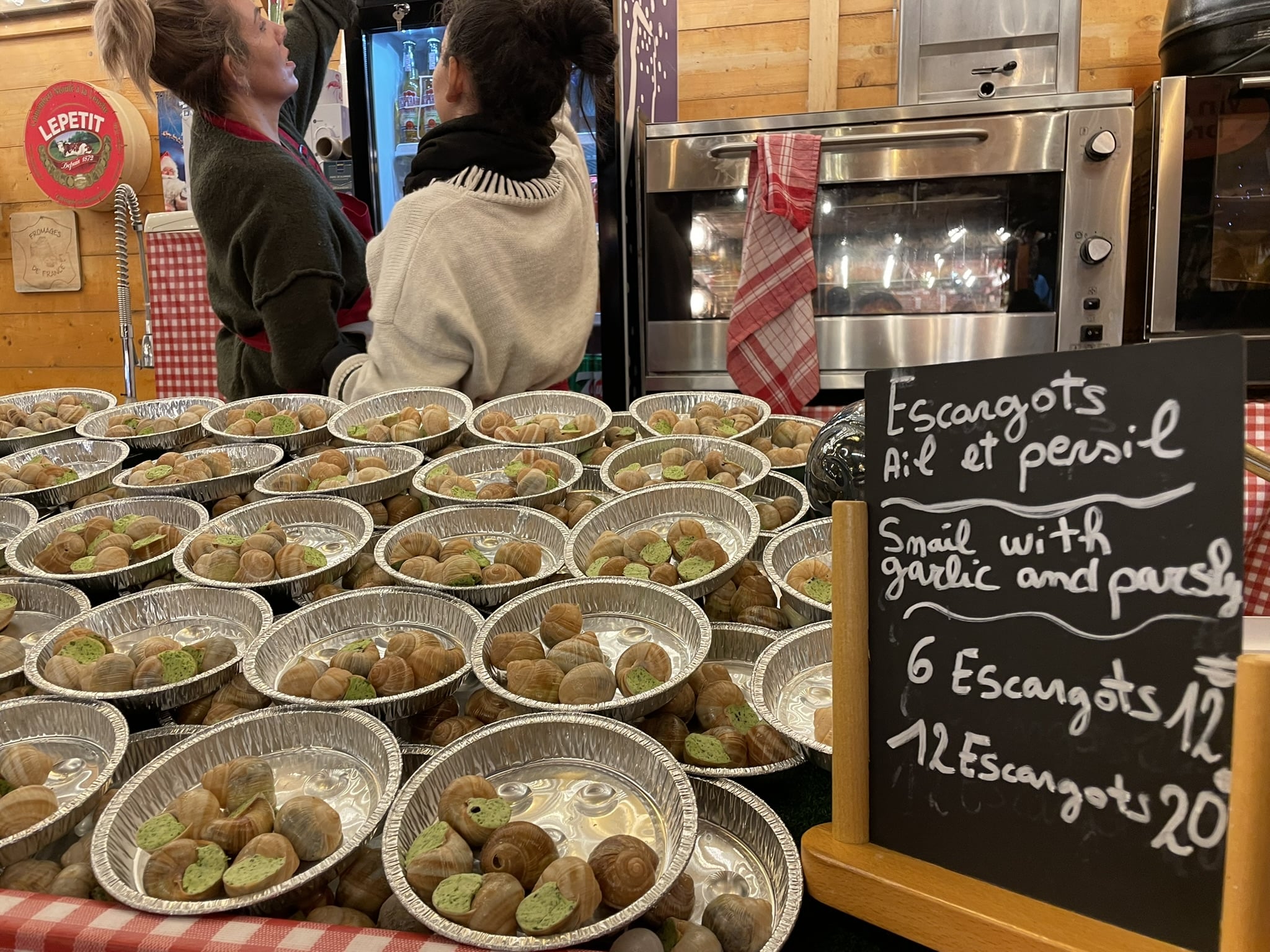 rows of tin trays full of escargot