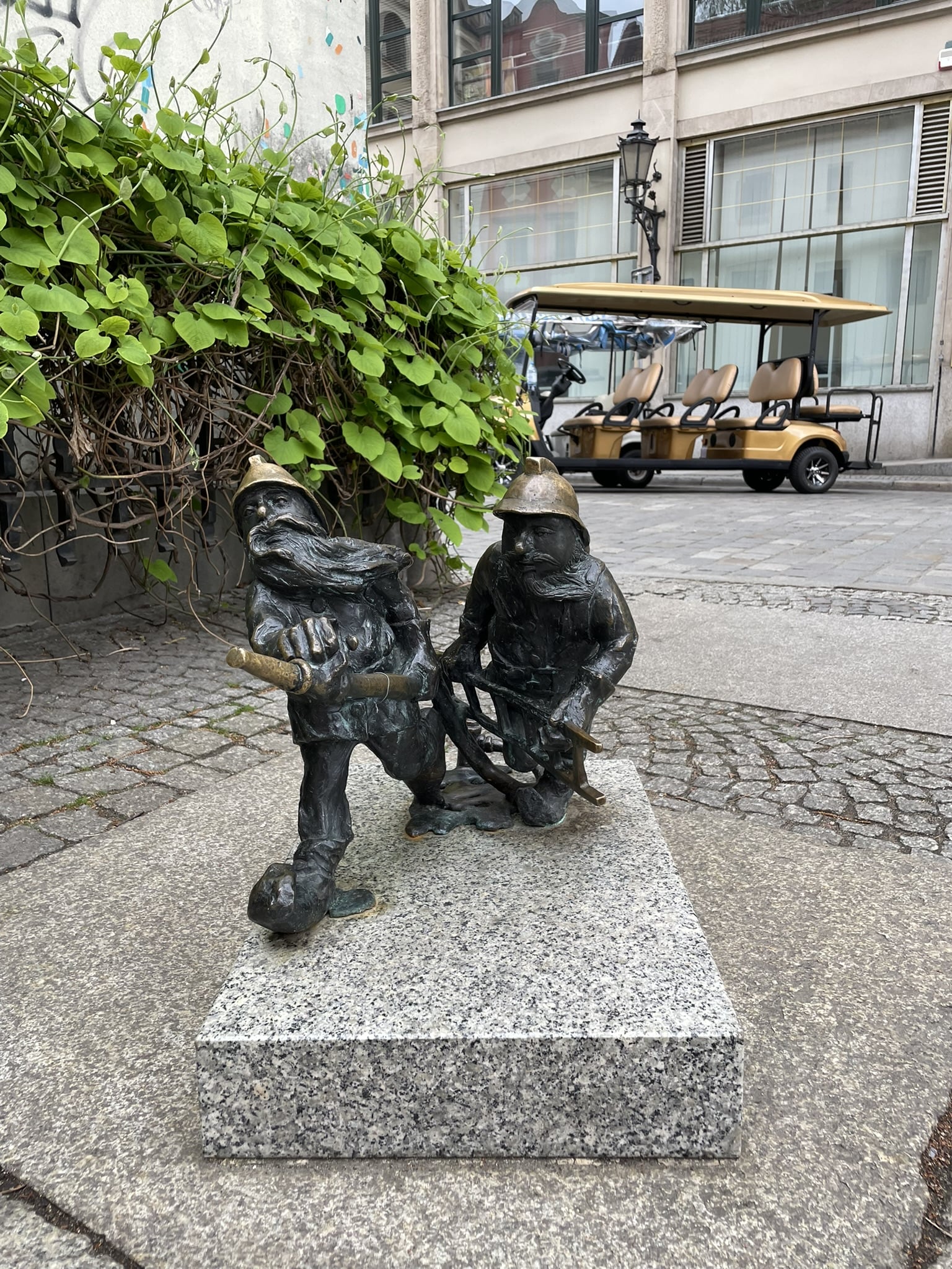 Two small firefighter gnome figures