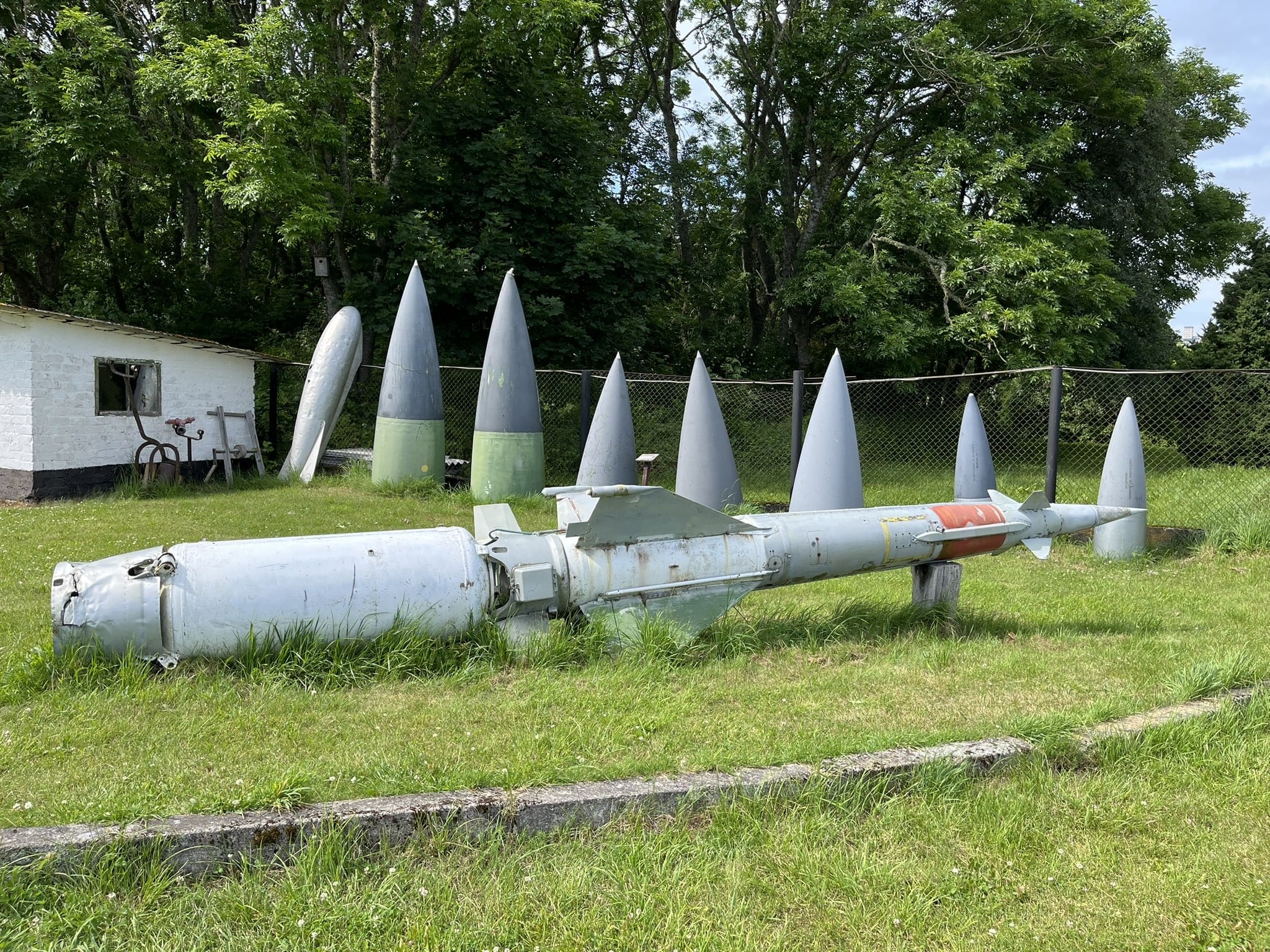Military weapons (possibly missles) in a field