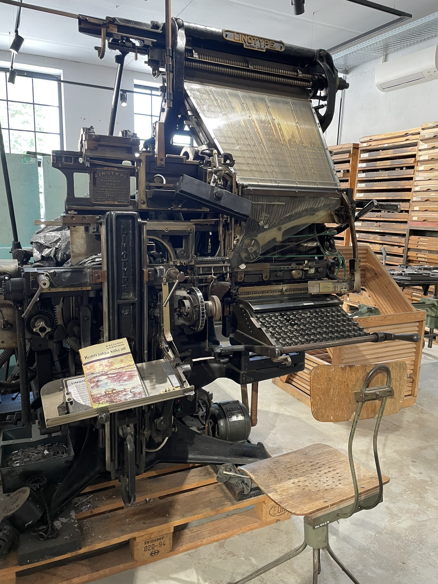Old printing press with keyboard, branded "Linotype"