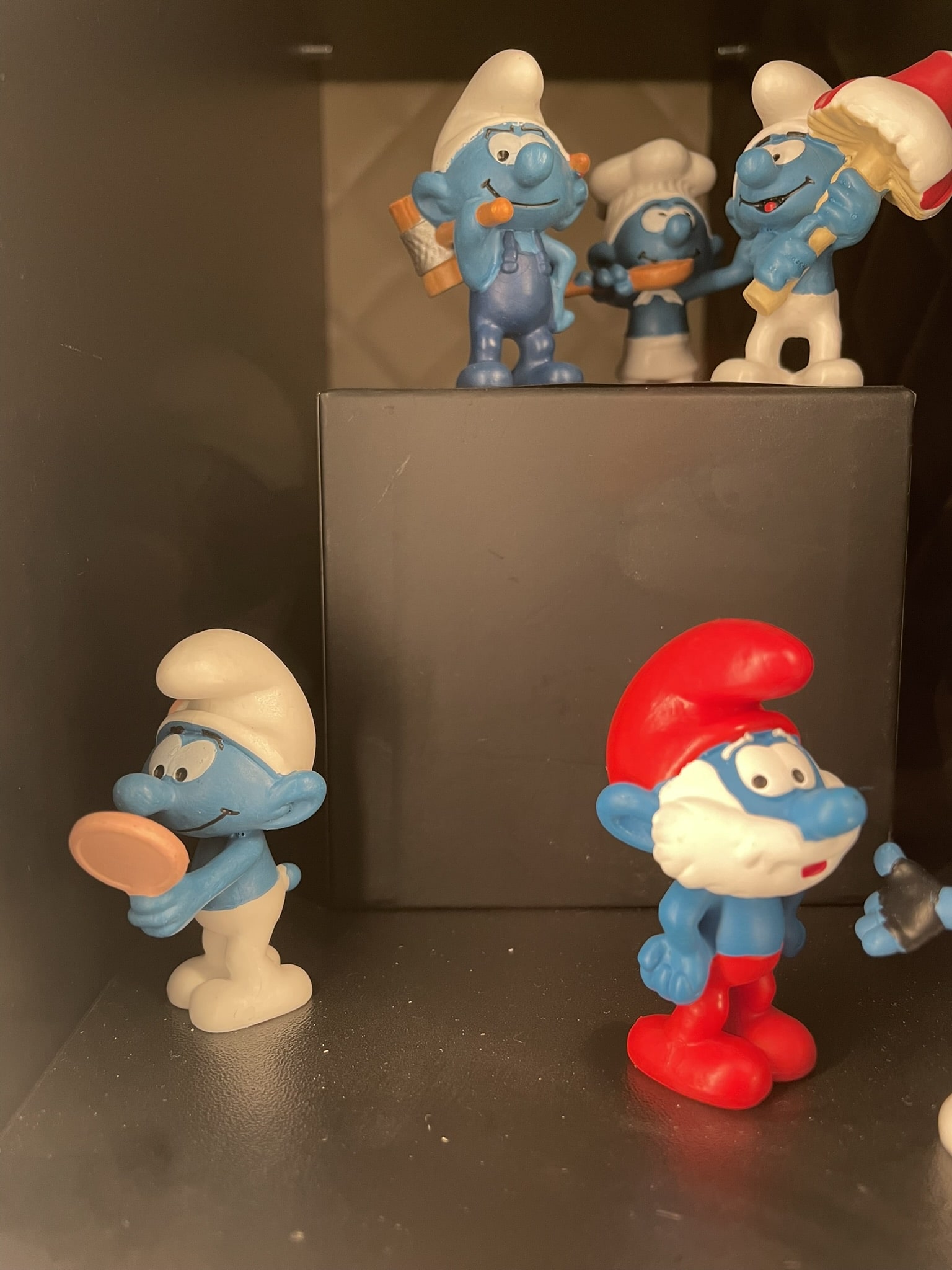 plastic figures of papa smurf and other smurf