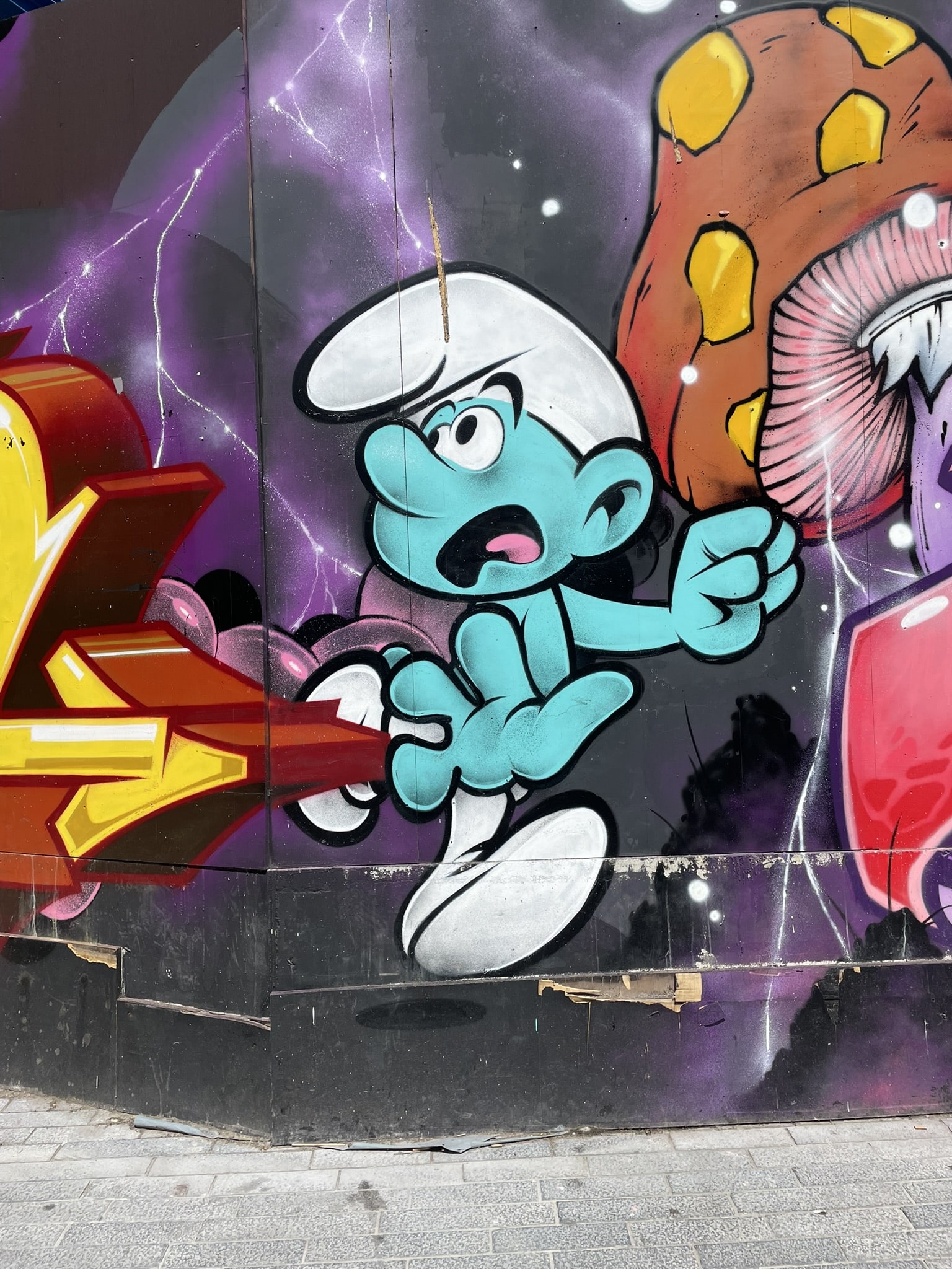 street art of a running smurf