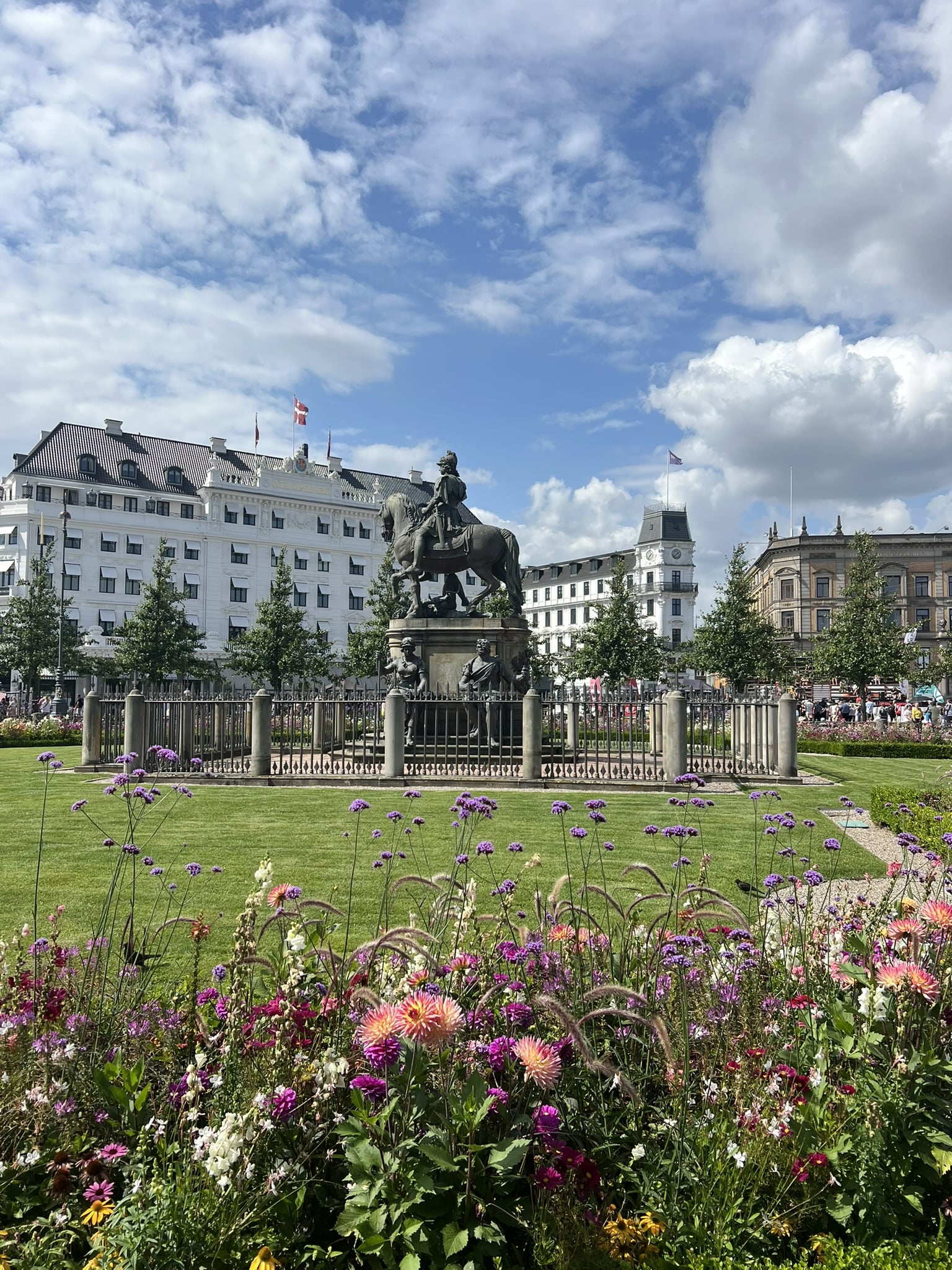 urban park and garden featuring a statue of a man on horseback