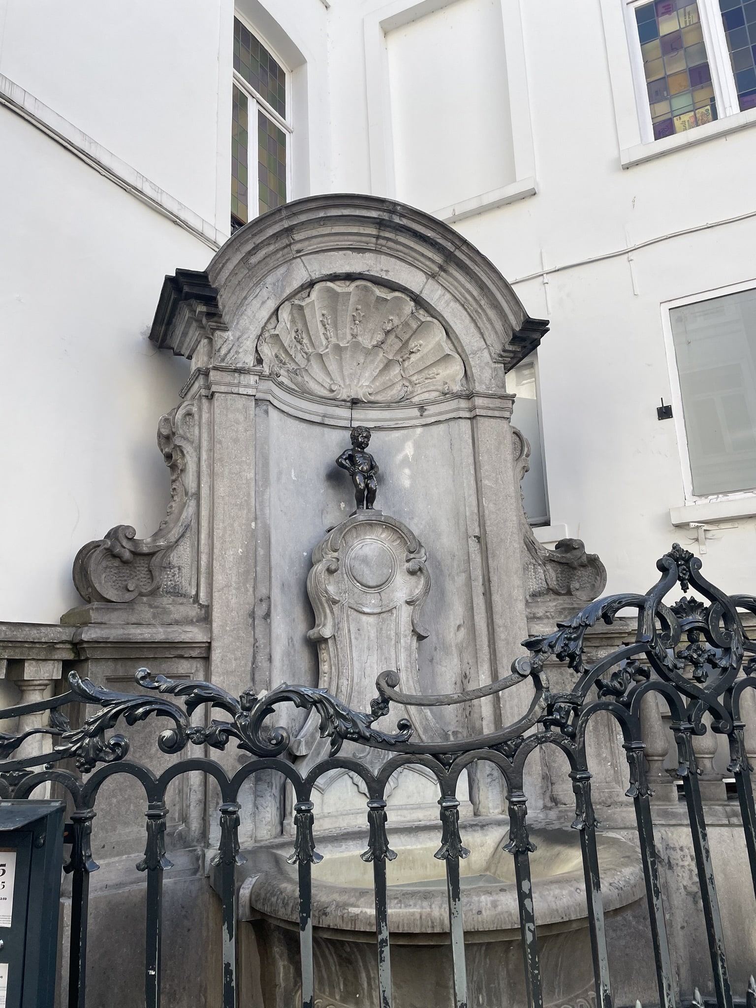 small statue/fountain of a little boy peeing