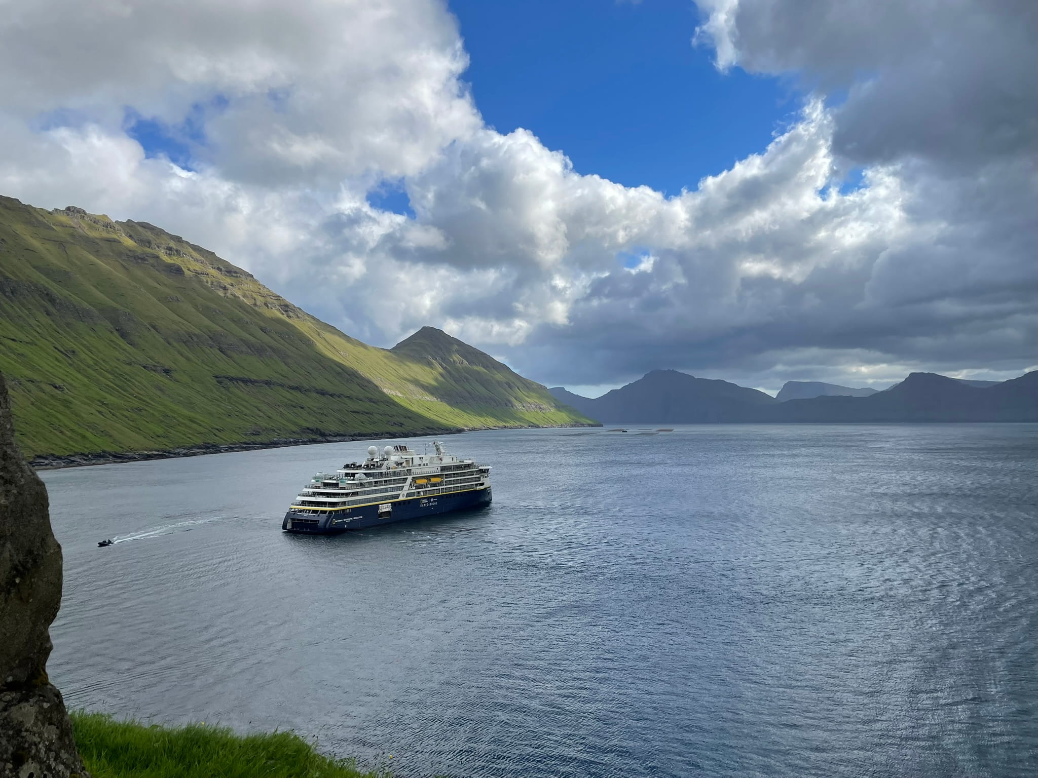 A large ship in a fjord