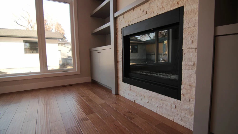 Alaska White Quartz ledgestone installed on a fireplace