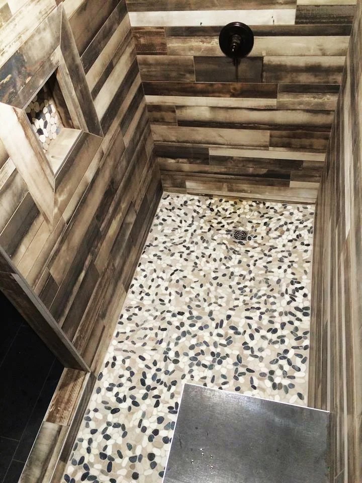 Bali Tranquil Cool Blend Flat Pebbles installed in a shower base