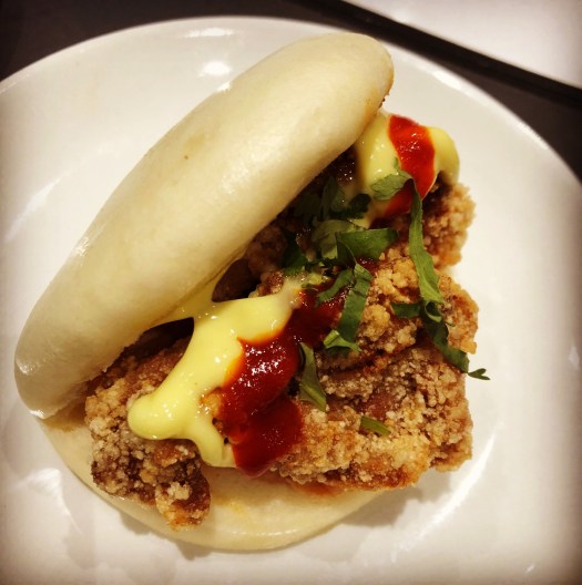 chicken bao made with 24 hour marinated fried chicken, fried wasabi, kimchi and coriander