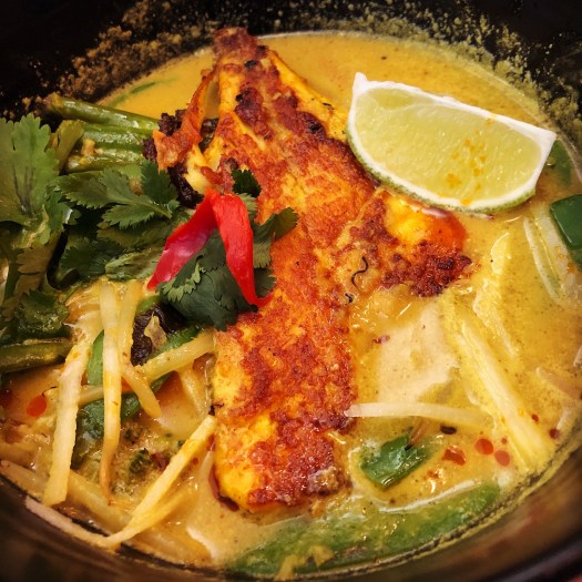 Nikko Curry with Sea Bream, which the menu describes as fragrant and citrusy. Coconut, lemongrass and turmeric soup, roasted butternut squash, tenderstem broccoli, mangetout, bok choi, beansprouts, chilli, coriander, ginger, fresh lime, and chilli oil. It came with a side of white rice with sesame seeds.