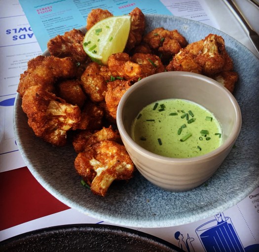 crispy cauliflower bites, crispy buttermilk-battered florets, with roast serrano allioli.