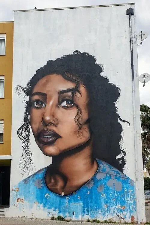 Street art by OJE in Quinta do Mocho, Lisbon