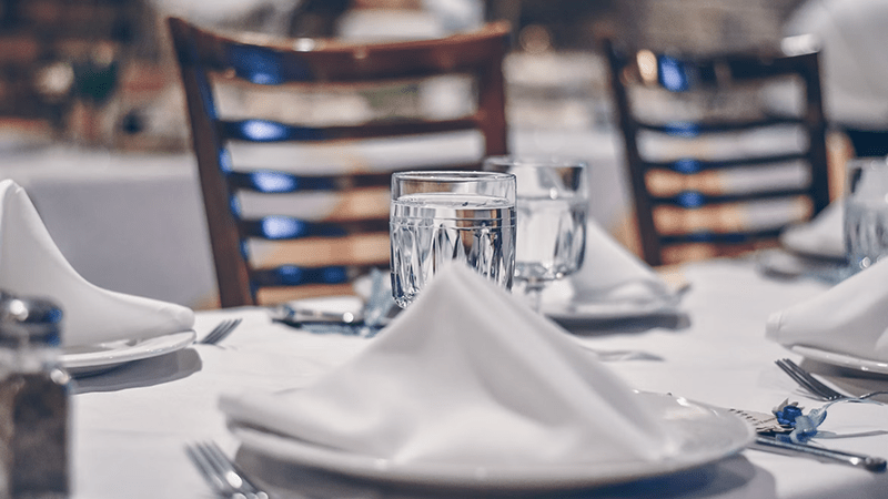 Dining table setup representing the SLIP Etiquette Luncheon and student workforce readiness training