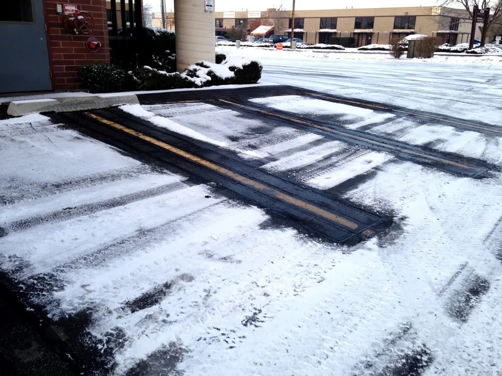 What are snow-melting systems for parking lots