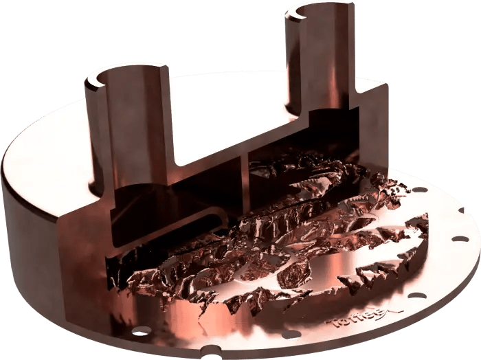 A copper heat sink. This photo shows a cutaway of the part so that you can see the inside. You can see the ToffeeX logo