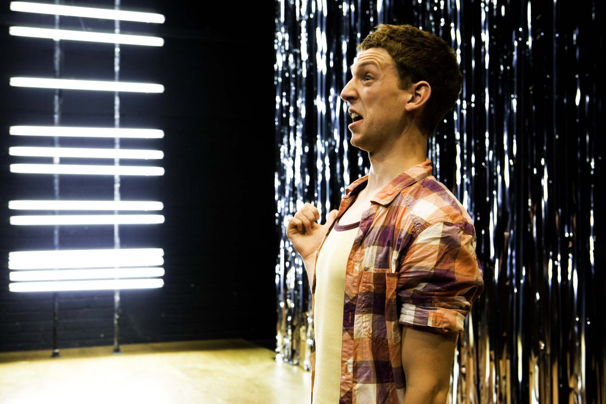 Dylan Kennedy (Seán) in All Over Town. Photo by Fiona Morgan.