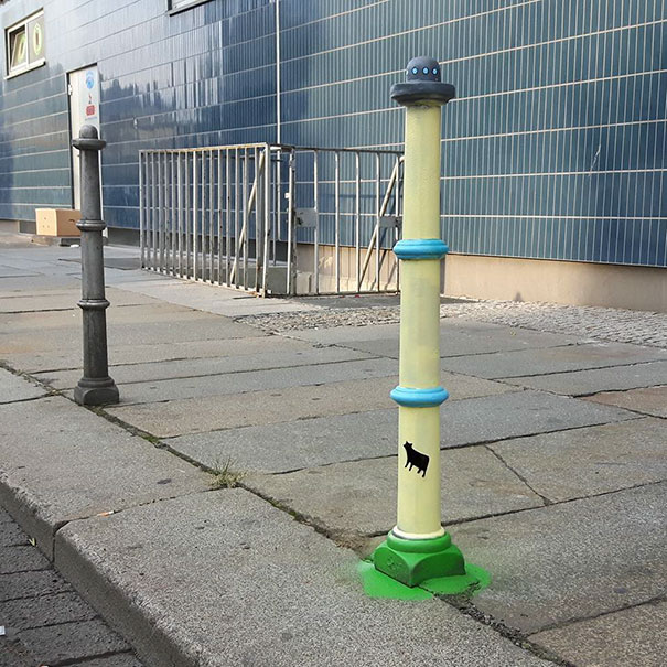 This pole was made into a UFO beaming up a cow. Get it?