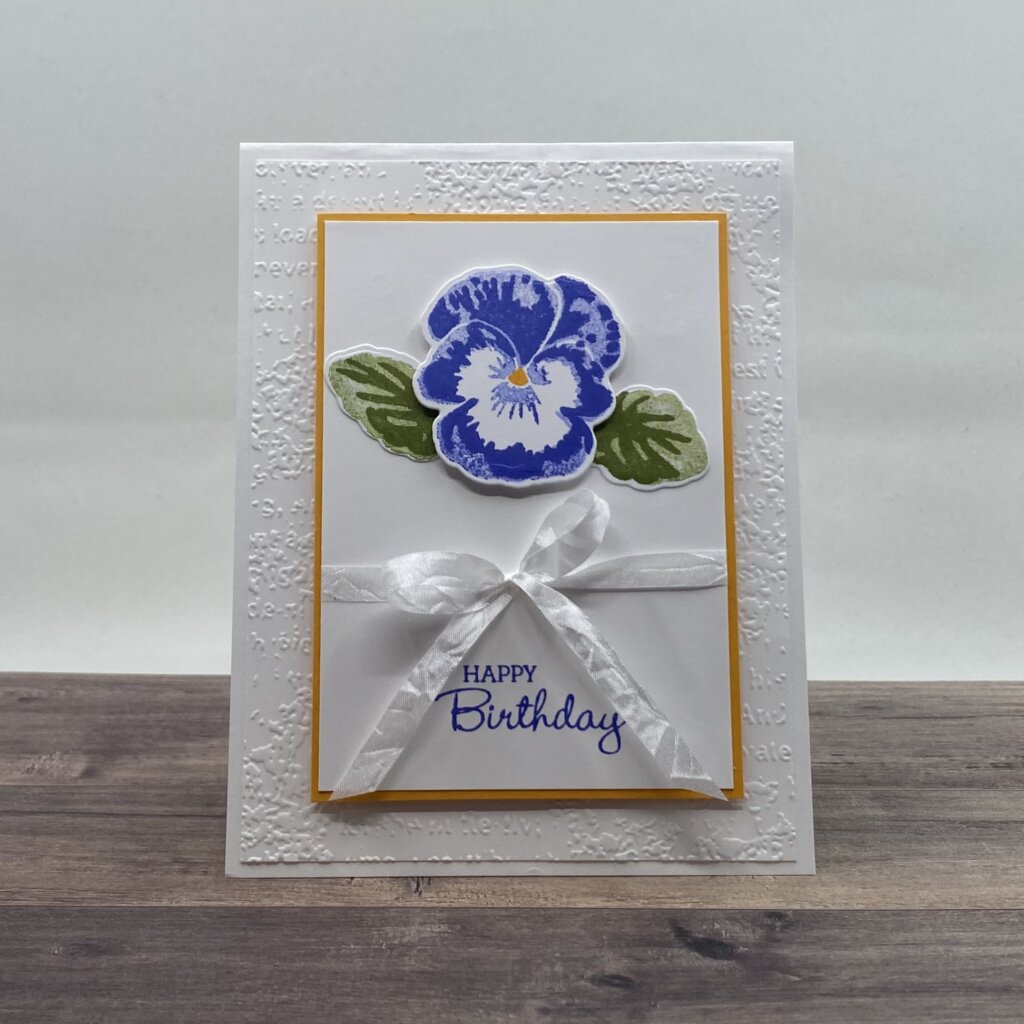 Stamped, embossed, and die cut.