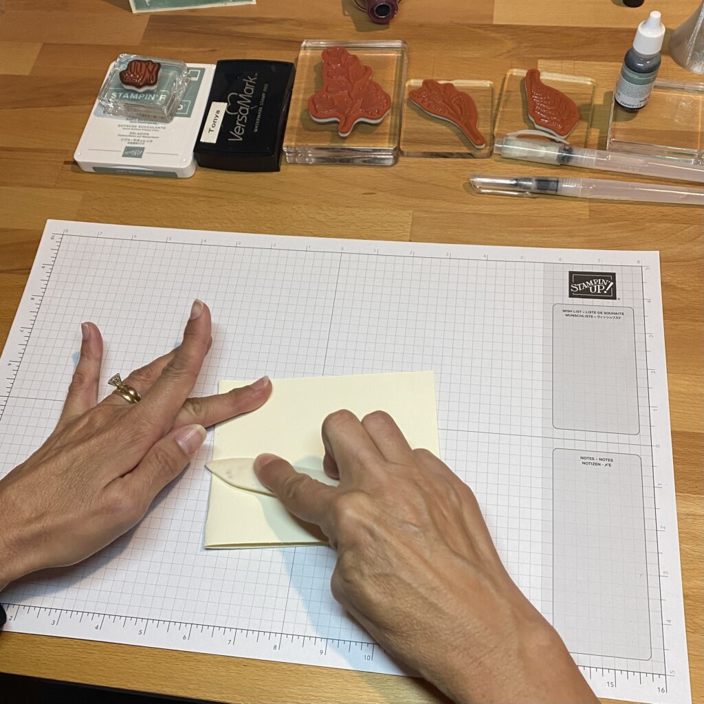 Fold vanilla card base in half.