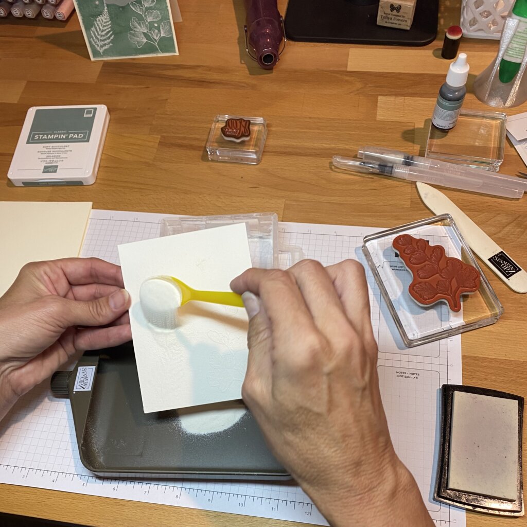 Sprinkle with white embossing powder