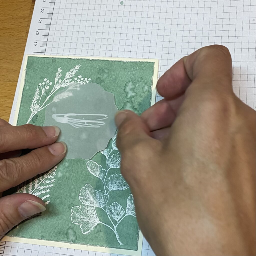 Glue vellum to front using a strip of glue that will be hidden by label