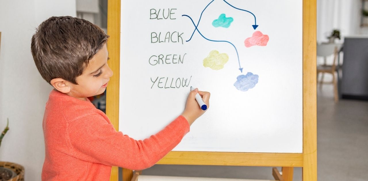 boy drawing on the board