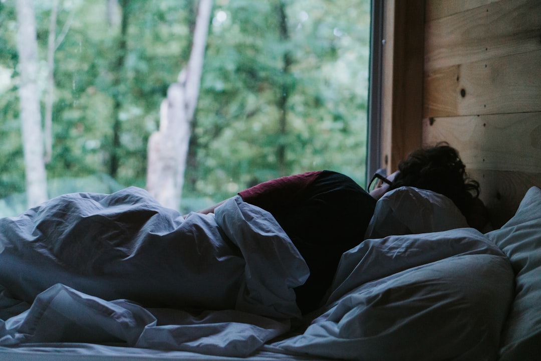 Person sleeping peacefully in bed