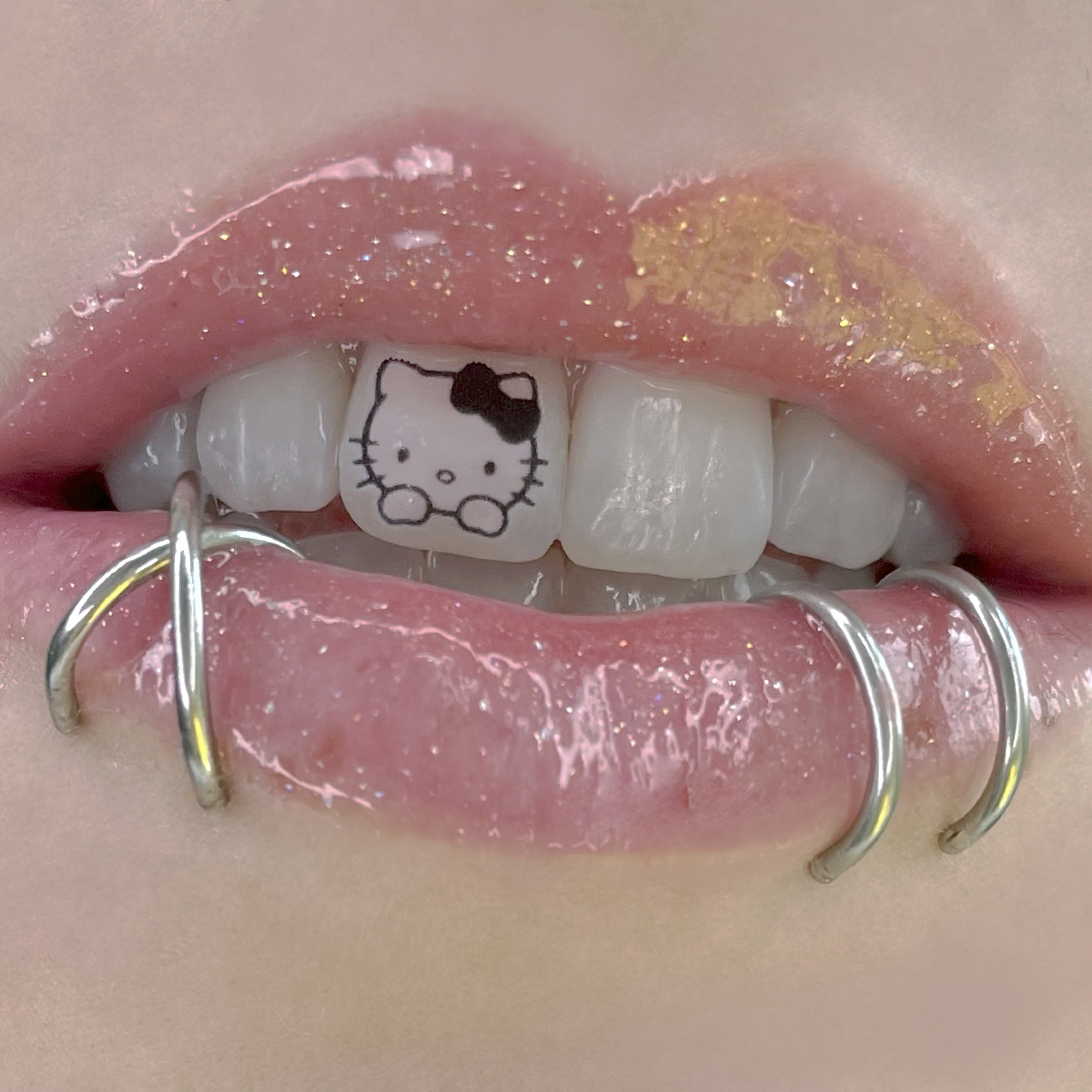 hello kitty tooth tattoos lip gloss cute piercings