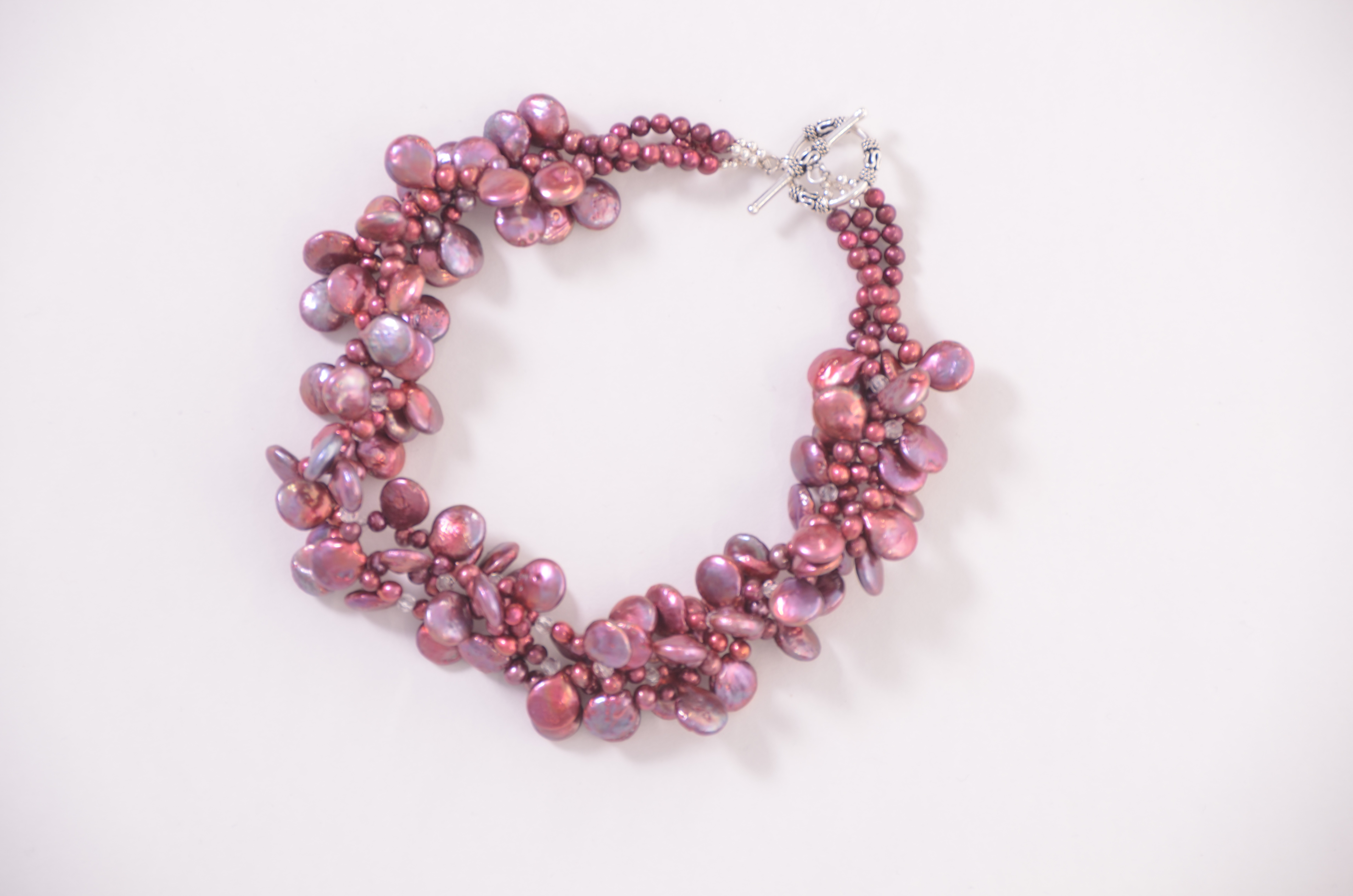 http://everyday-jewels.com/shop/fuchsia-freshwater-pearls-crystal-three-strand-twist/